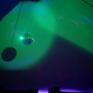 Disco Ball Under a Green Spotlight