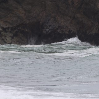 Wild Waves Crash Against Rugged Coastal Cliffs