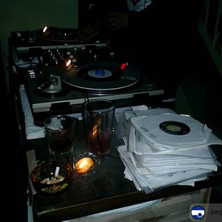 DJ spinning records by candlelight