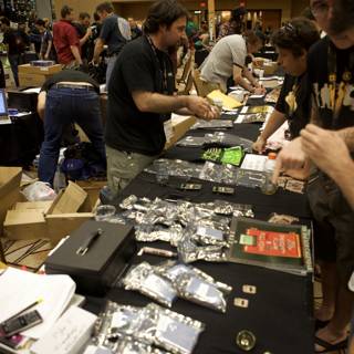 Tech Enthusiasts Gather around Electronics Table