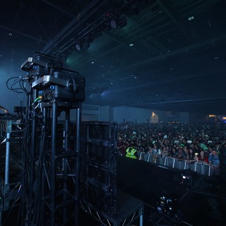 DJ Performs Before Massive Indoor Festival Crowd