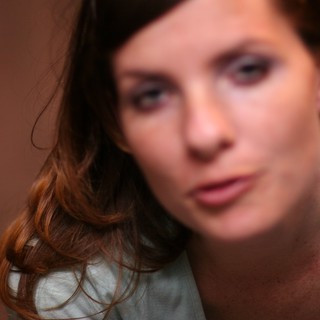 Pensive Young Woman in Soft Bokeh Portrait