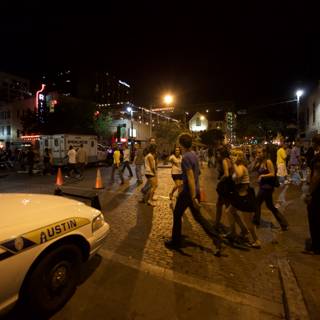 Nighttime Crowd Strolls Down Austin Street