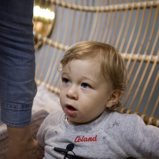 Toddler in Mickey Mouse Shirt at Indoor Venue