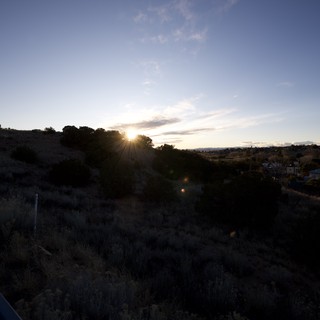 Sunset Over Rolling Hills and Rural Valley