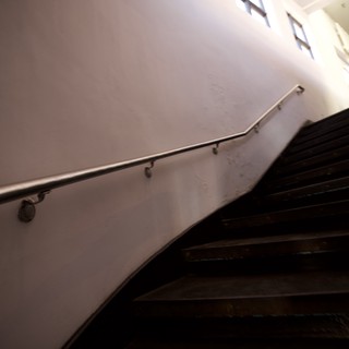 Ascending the Shadows: Minimalist Stairwell Perspective