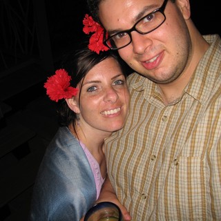 Couple Smiling Together at a Tropical Evening Event