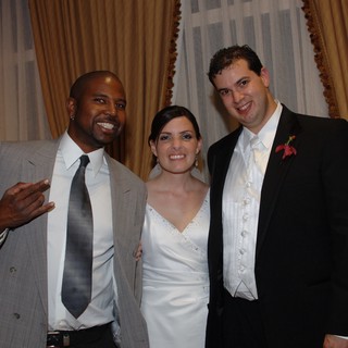 Joyful Wedding Celebration with Bride, Groom, and Guest