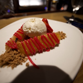 Gourmet Dessert Plate with Vanilla Ice Cream and Berry Drizzle