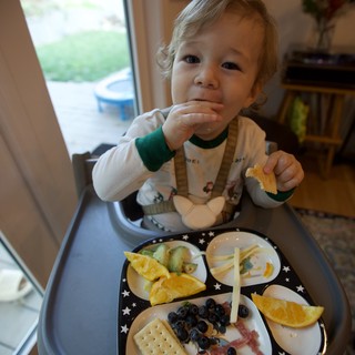 Toddler Enjoying Healthy Snack Time at Home