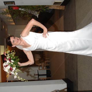 Radiant Bride Poses with Bouquet in Elegant Venue
