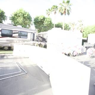 Man and Trailer with White Fence in Coachella