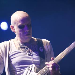 Bald Man Rocks Coachella Stage with Epic Guitar Skills