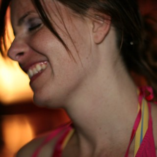 Joyful Woman Laughing in Warm Evening Light