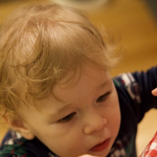 Curious Toddler Exploring Christmas Morning Activities