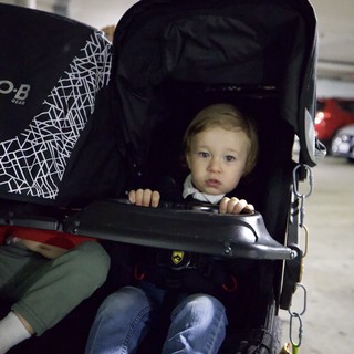 Toddler in Stroller at Baby Rave Event