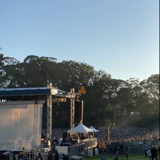 Concert Crowd Gathers Under Blue Skies