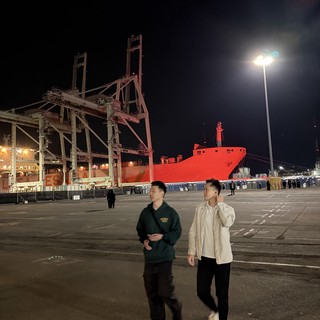 Night at the Industrial Port with Red Ship
