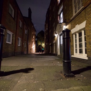 Narrow Cobblestone Alley at Night in London