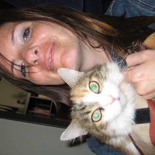 Woman and Her Green-Eyed Calico Cat Portrait