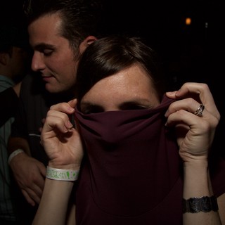 Playful Face Hide at Late Night Club Event