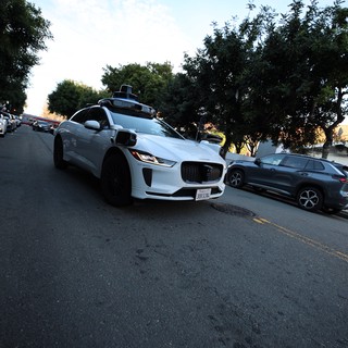 Autonomous Jaguar I-PACE Self-Driving Vehicle on Residential Street