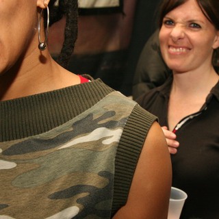 Two Women Laughing at a Casual Indoor Party
