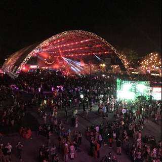 Night-time Concert Crowd in Front of Illuminated Dome
