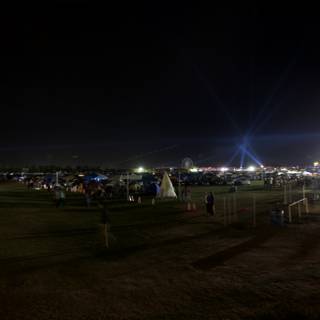 Night Sky Illuminated by Crowd and Lighting at Coachella Festival