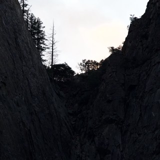 Twilight View Through Narrow Rock Chasm in Yosemite