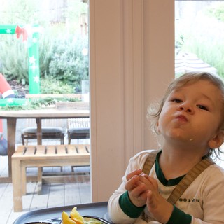 Young Child's Thoughtful Prayer Moment at Christmas