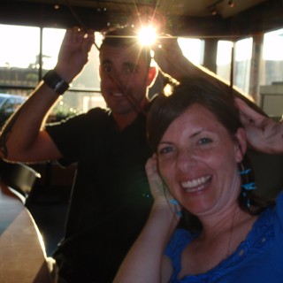 Friends Laughing Together at Sunset Restaurant