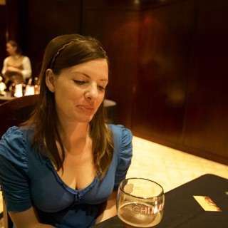 Woman Contemplating Over Chimay Beer at Bar
