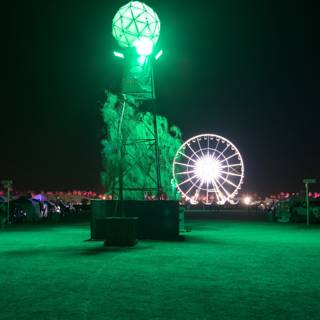 Green Light Illuminates Ferris Wheel