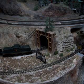 Miniature train arrives at the tunnel