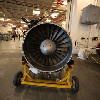 Aircraft Jet Engine on Display in Maintenance Hangar