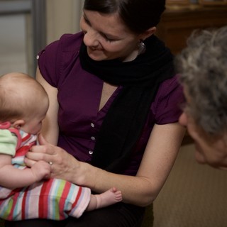 Three Generations Share a Tender Indoor Moment