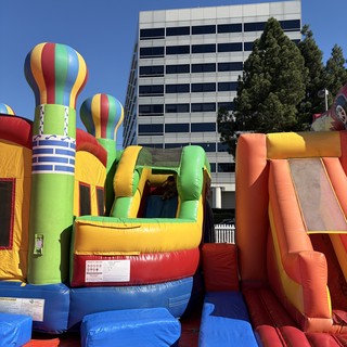 Colorful Inflatable Bounce House Complex at Urban Event