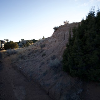 Scenic Train Journey Through Desert Canyon at Dusk