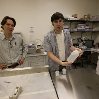 Two men conducting experiments in laboratory