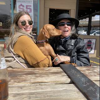 Rhoda and Lori's outdoor coffee with furry friend