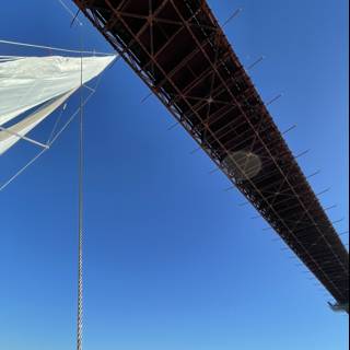 Golden Gate Bridge shining under brilliant blue sky