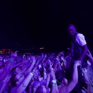 Man Rises Above the Crowd at Coachella Concert