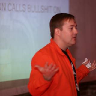 Orange-Jacketed Presenter at Barcamp 3
