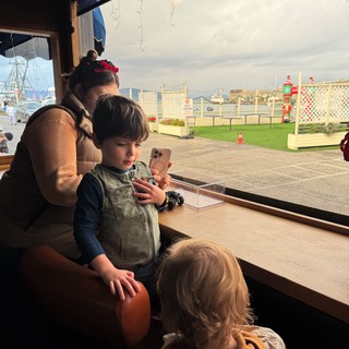 Coastal restaurant or visitor center overlooking harbor