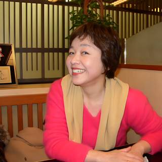 Kuniko Inoguchi: Portrait of a Smiling Woman in Kobe