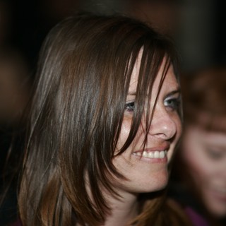 Candid Smile of a Young Woman in Crowd