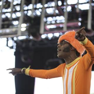 Orange Outfit Man Performs on Stage