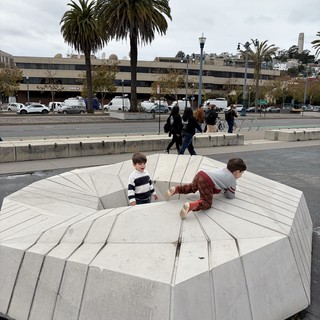Children Playing on Modern Urban Amphitheater Structure