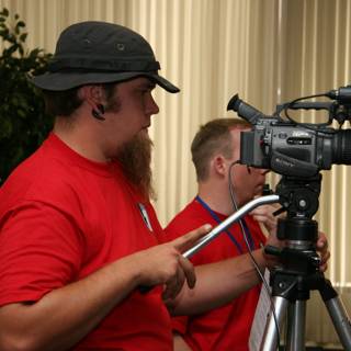 Red Shirted Photographer with Tripod